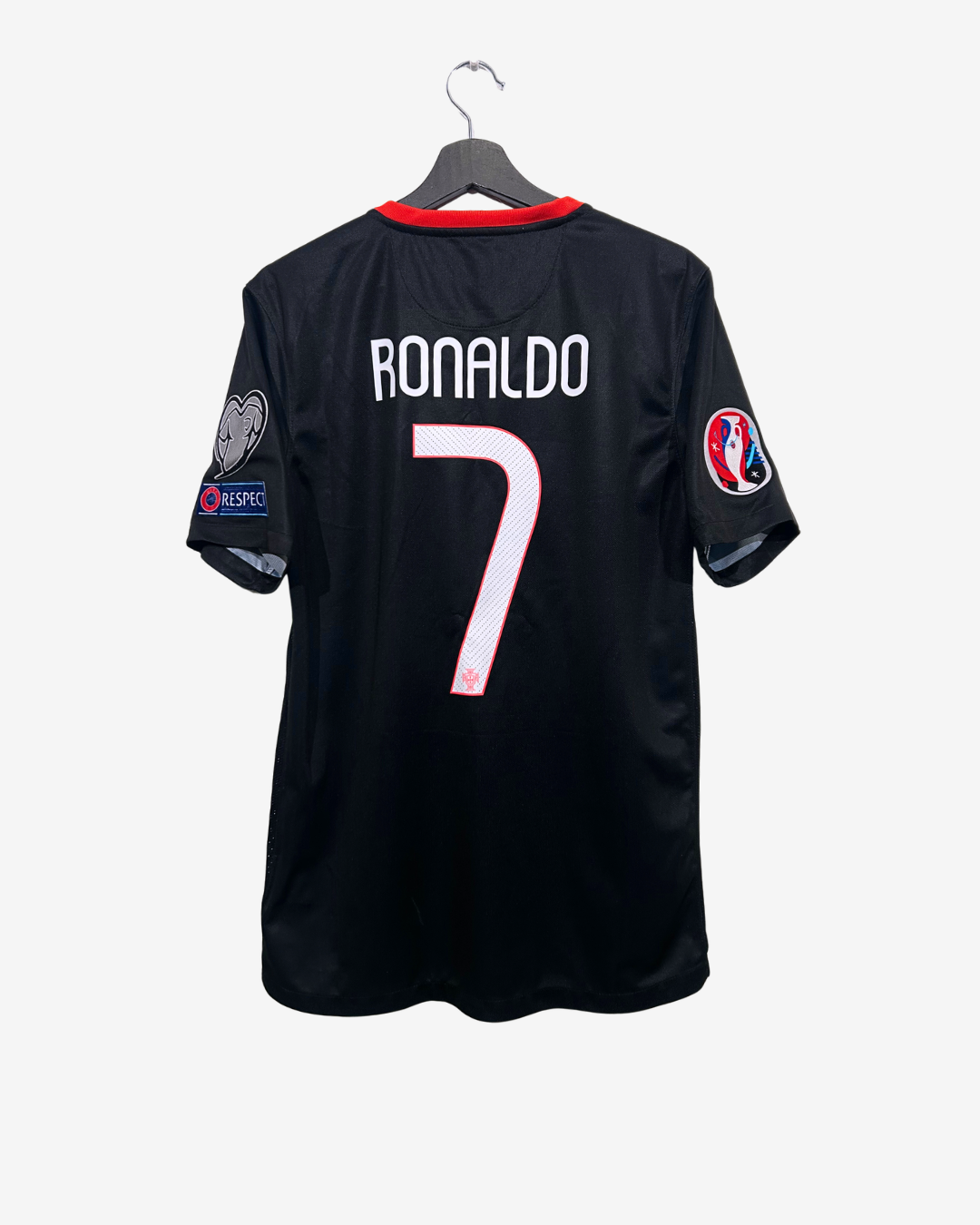 Black sports jersey with 'RONALDO 7' on a hanger against a white background
