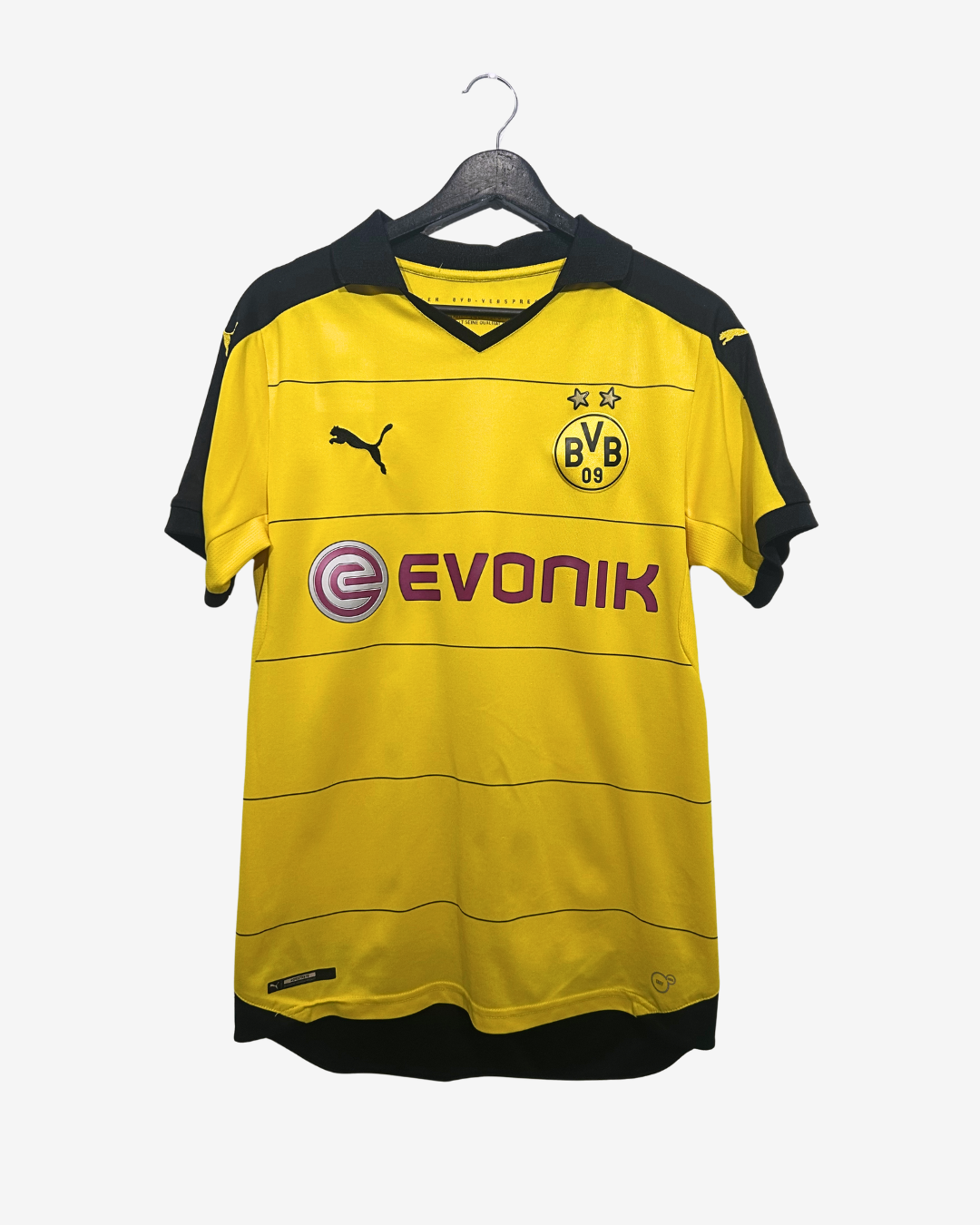 Yellow sports jersey with branding on a hanger against a white background