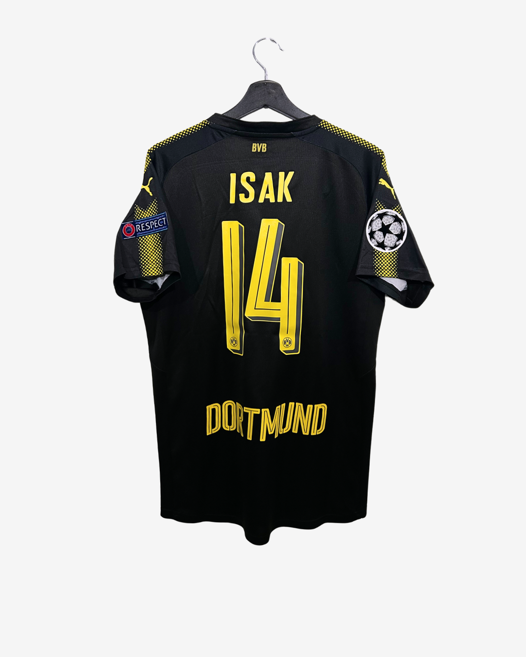 Black sports jersey with yellow text ISAK on a hanger against a white background
