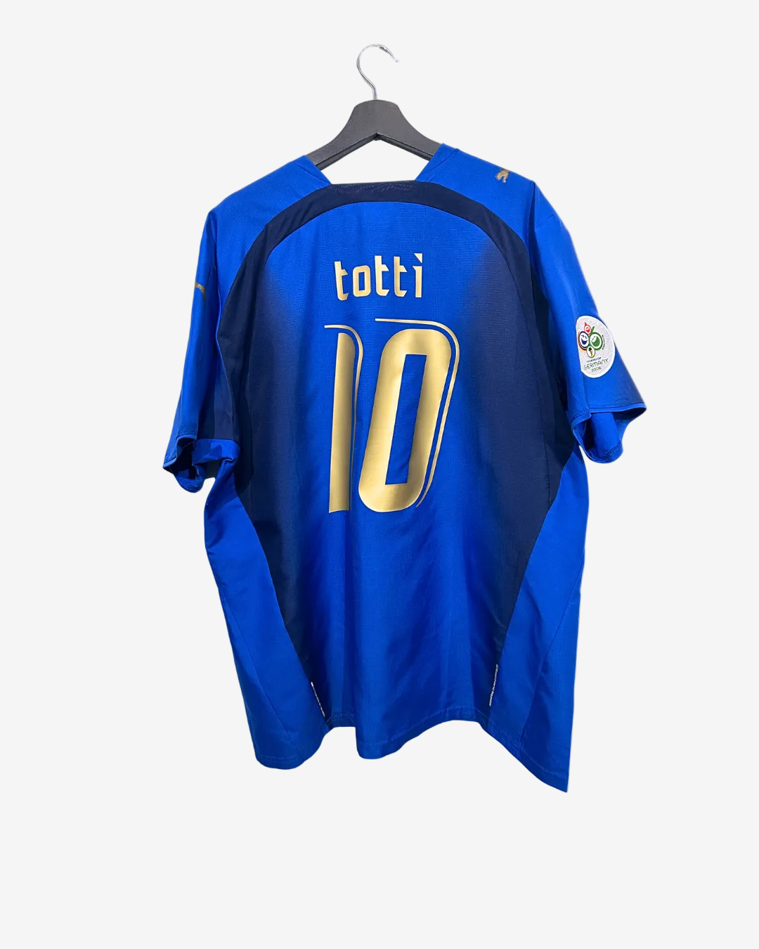Blue sports jersey with 'totti' and number '10' on a hanger