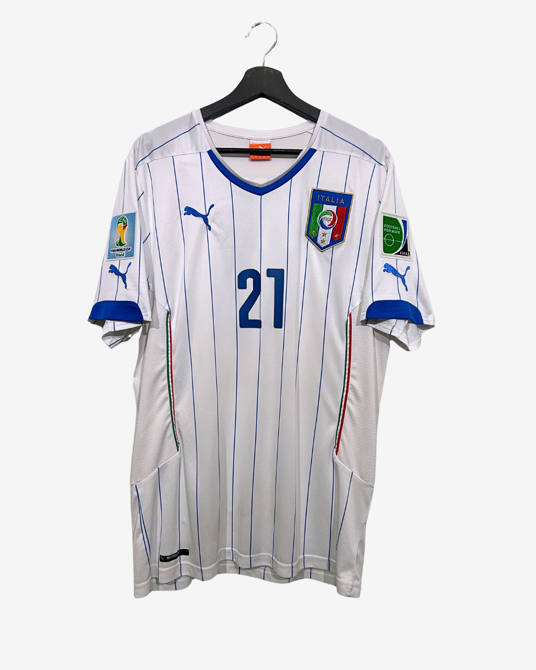 White soccer jersey with blue accents and number 21, hanging on a black hanger against a white background.