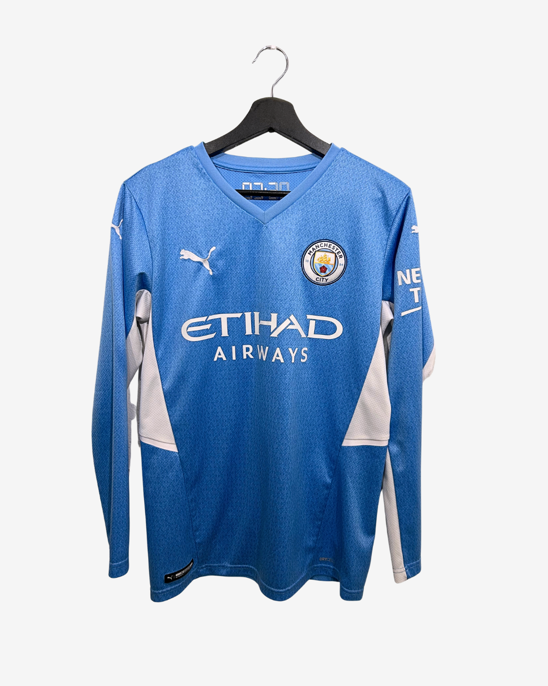 Blue sports jersey with visible branding on a hanger against a white background