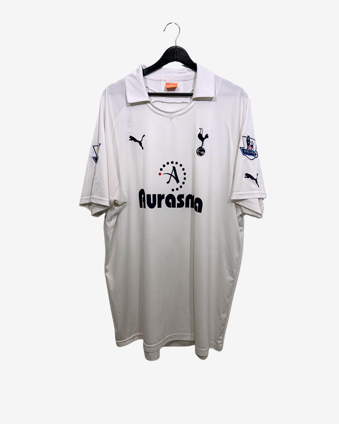 White sports jersey with branding on a white background