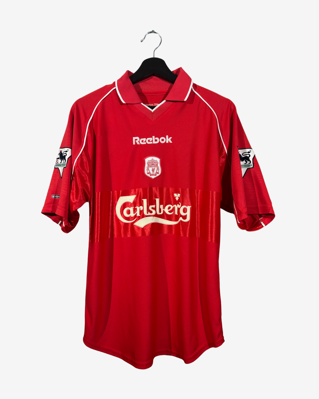 Red sports jersey with visible branding on a white background