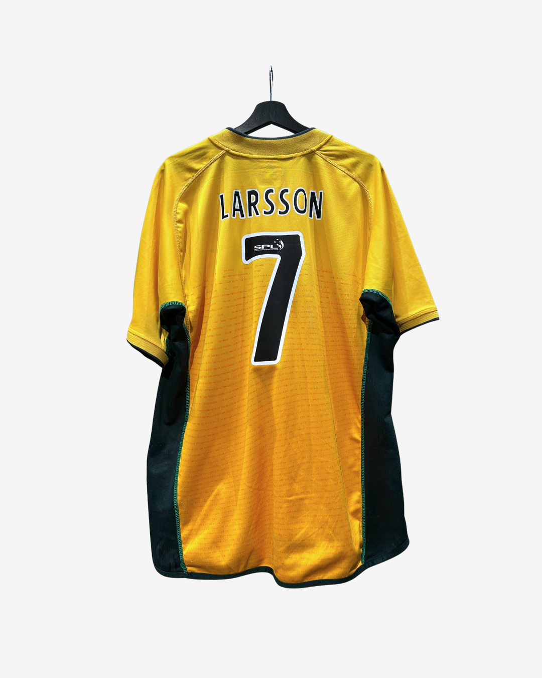 A yellow and green soccer jersey with 'LARSSON' and the number '7' on the back, hanging on a black hanger against a light gray background.