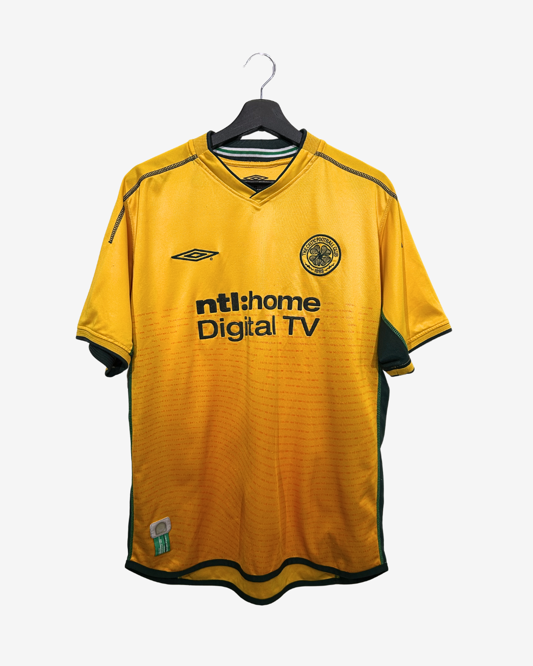 Yellow sports jersey with branding on a hanger against a white background