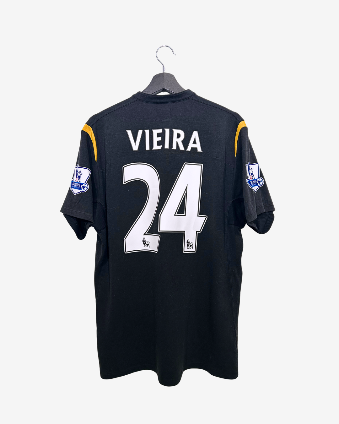 Black sports jersey with 'Vieira' and number '24' on a white background