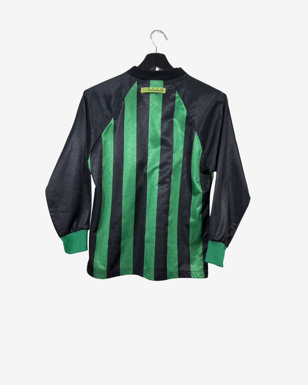 A vintage long-sleeve soccer jersey with vertical green and black stripes on the front, hanging on a black hanger against a light gray background.