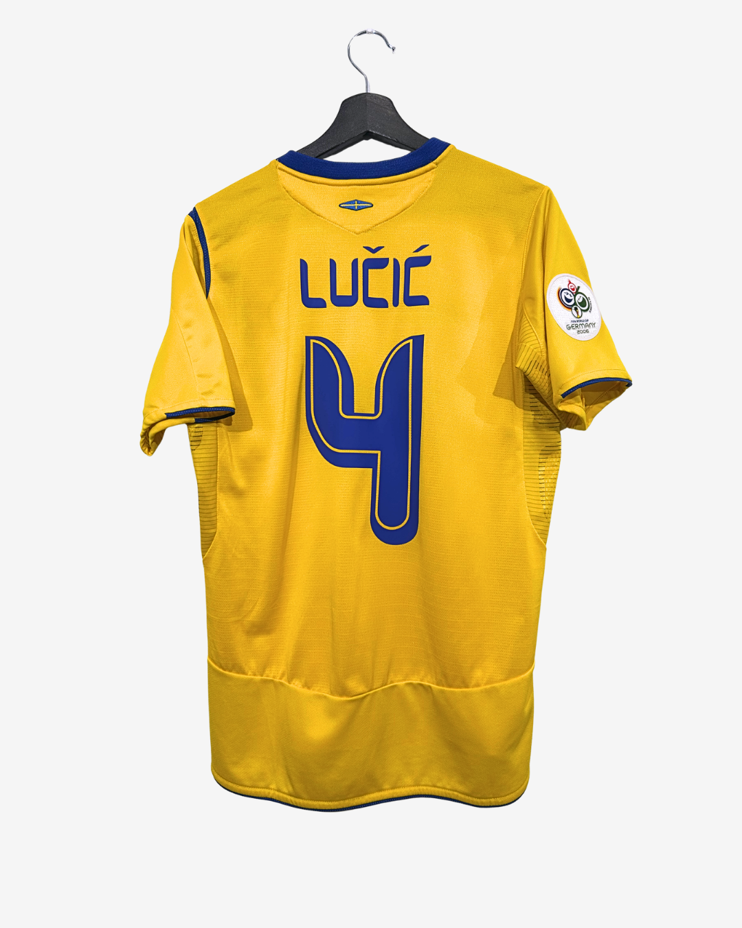 Yellow sports jersey with blue lettering and number on a hanger against a white background