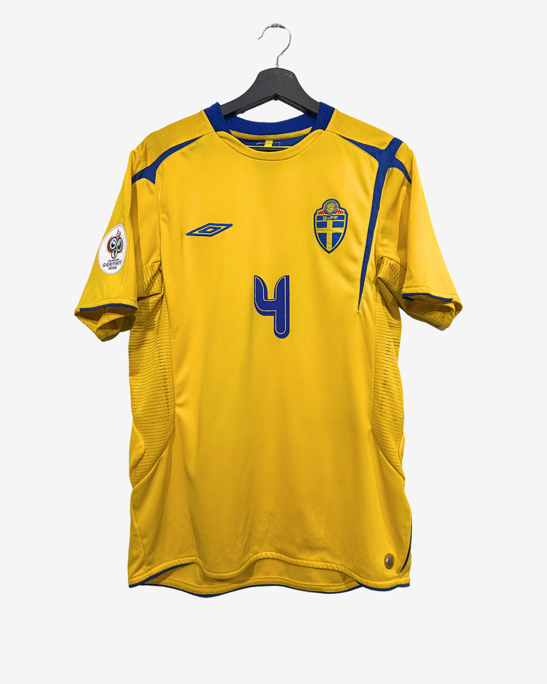 Yellow sports jersey with blue accents on a hanger against a white background