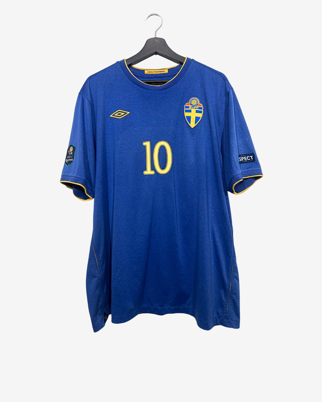 Blue sports jersey with number 10 on a hanger against a white background