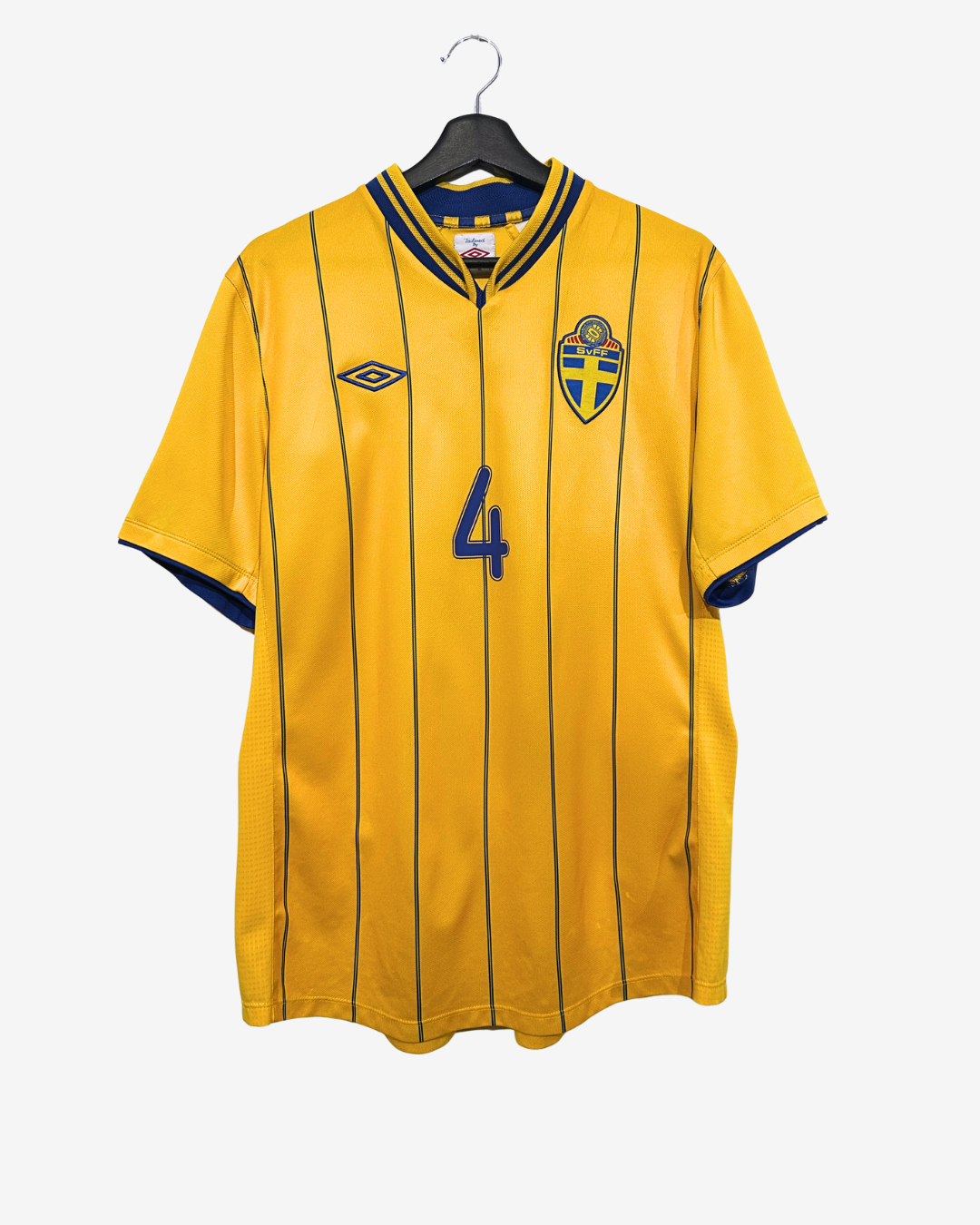 Yellow sports jersey with blue accents on a hanger against a white background