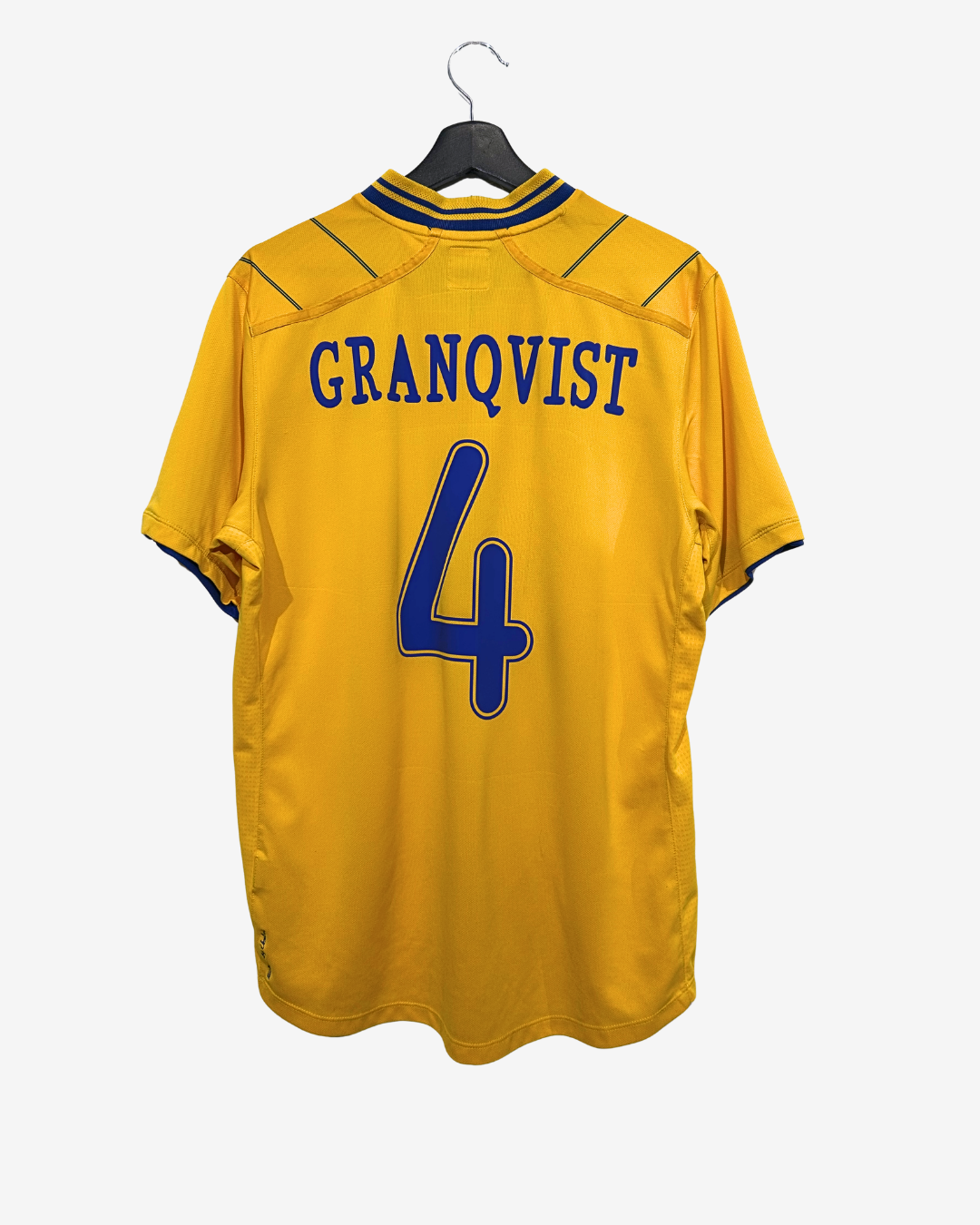 Yellow sports jersey with 'GRANQVIST' and number '4' on a hanger against a white background