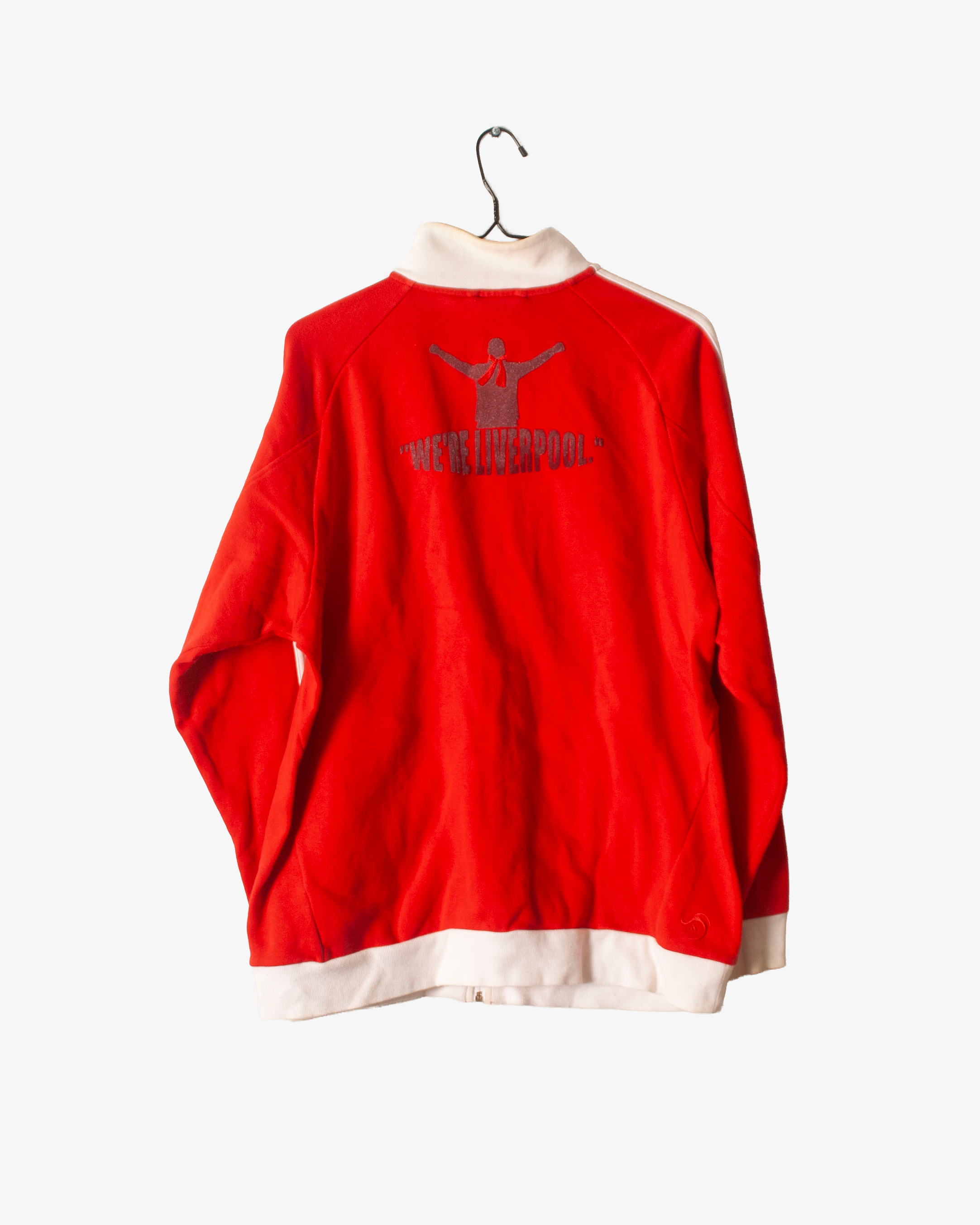 Red sports jersey with white collar on a hanger against a white background