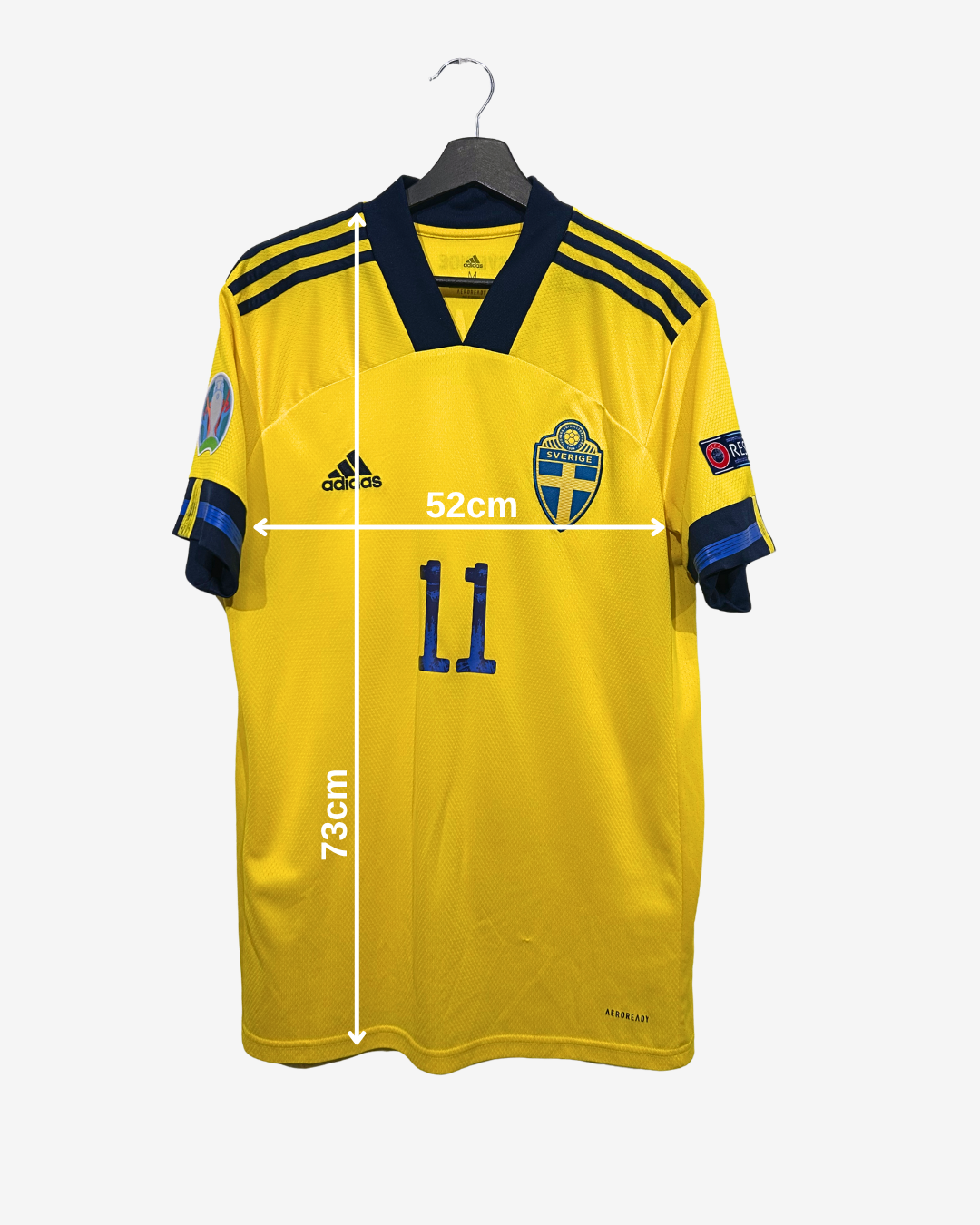 Yellow sports jersey with measurements on a white background