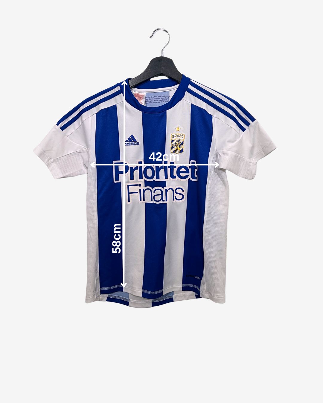 White and blue striped sports jersey on a hanger with visible branding.