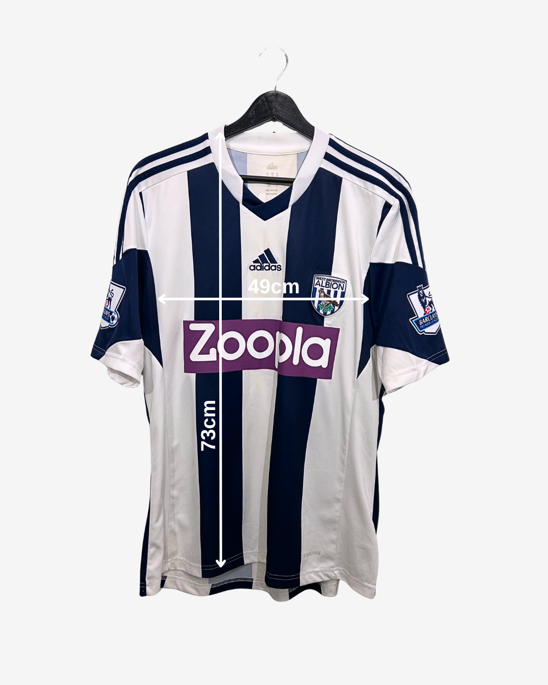 White and navy sports jersey with Adidas and Zoopla logos on a white background