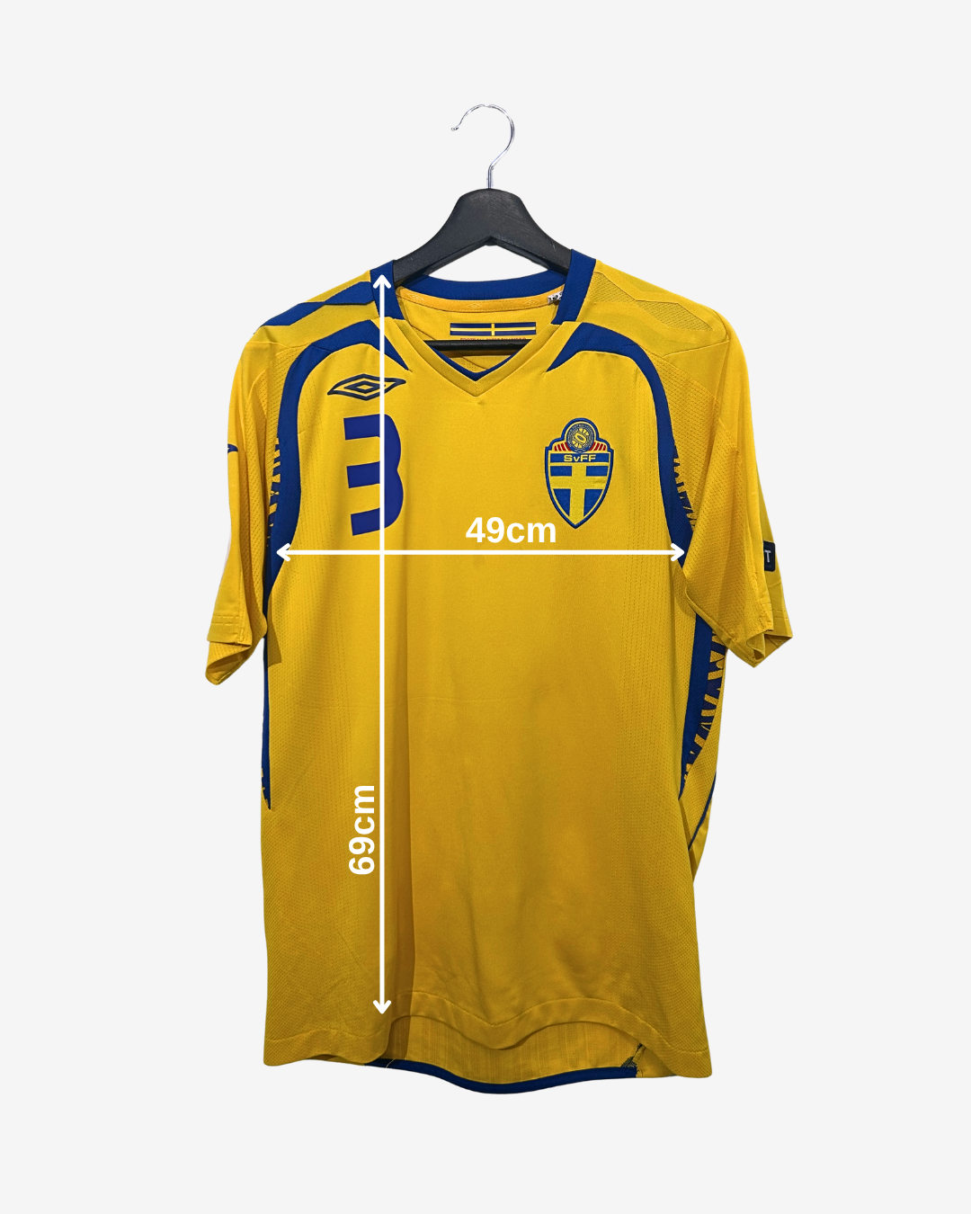 Yellow sports jersey with blue accents on a hanger, showing measurements.