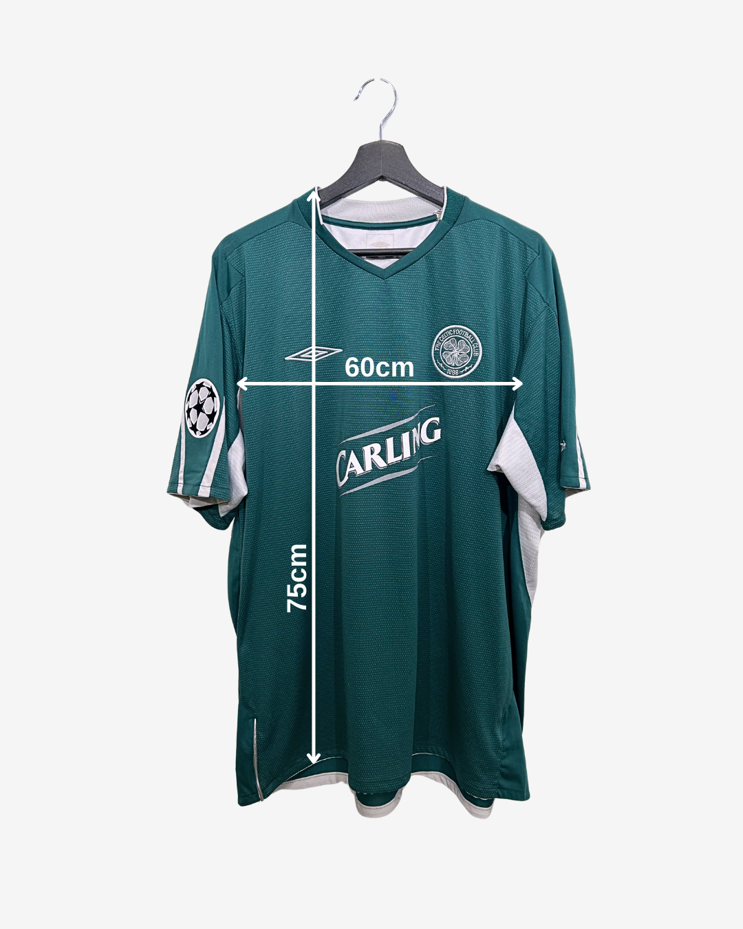 Green sports jersey with measurements on a white background