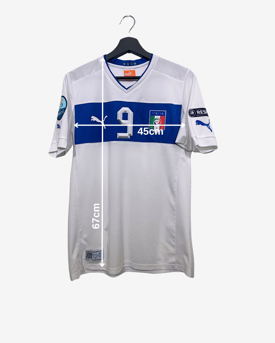 White sports jersey with blue and red accents on a hanger against a white background