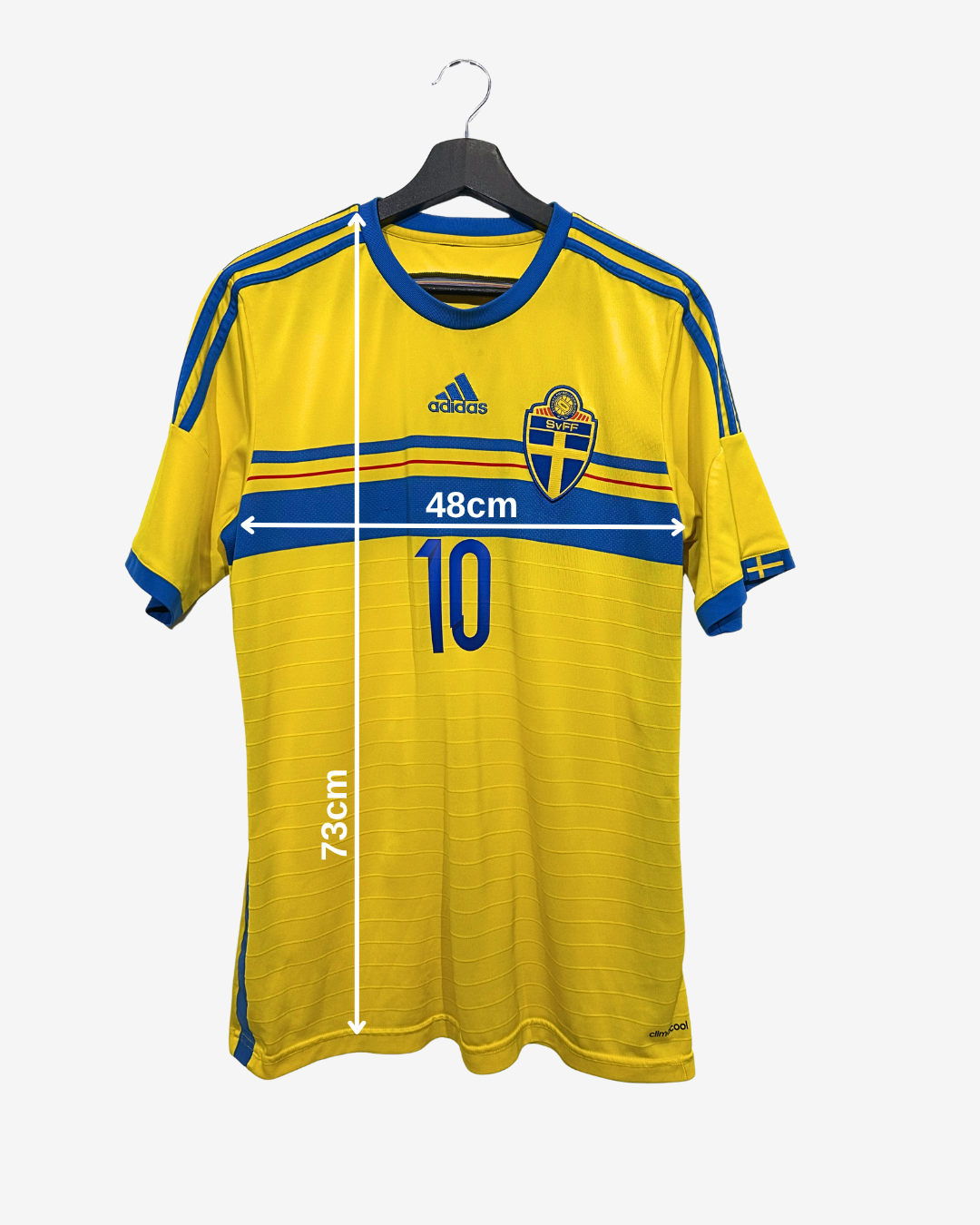 Yellow sports jersey with blue accents on a hanger, featuring Adidas logo and measurements.