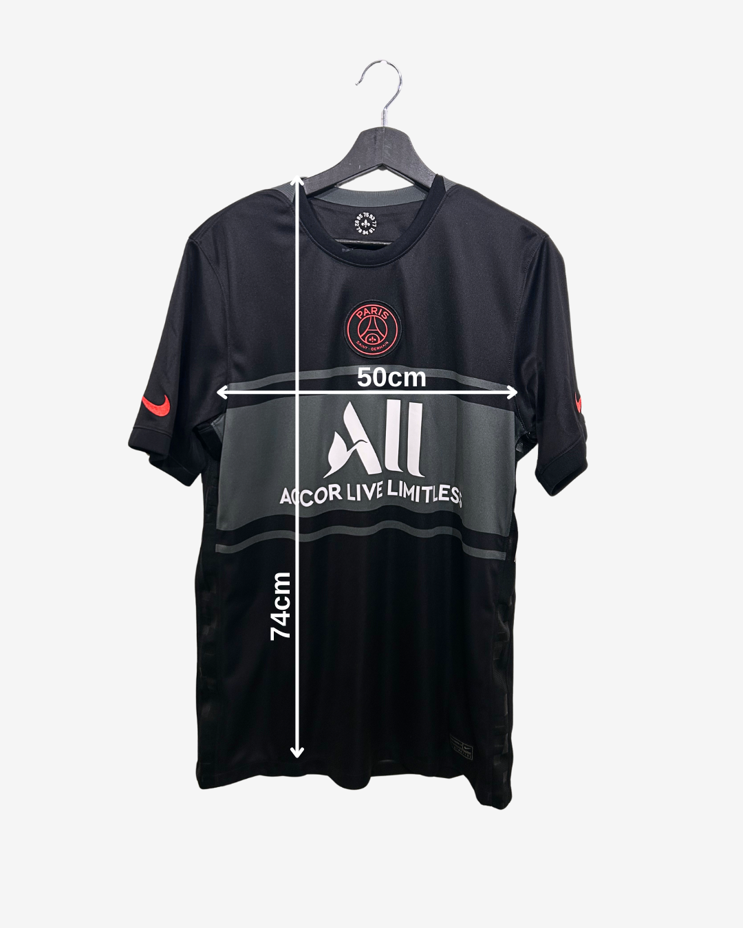 Black sports jersey with measurements on a white background