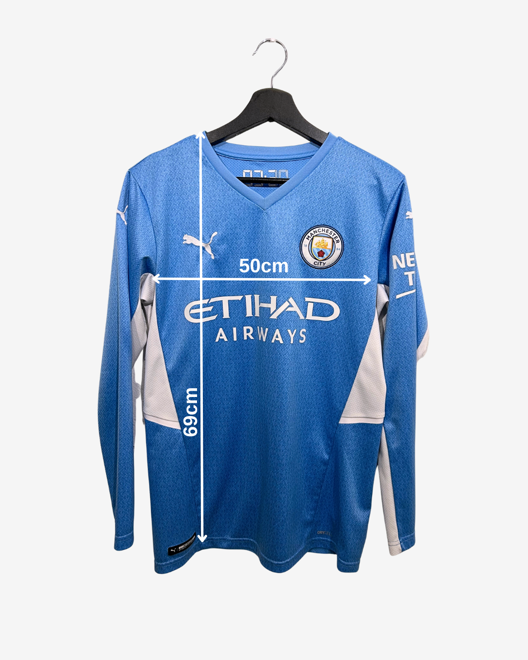 Blue sports jersey with measurements on a white background