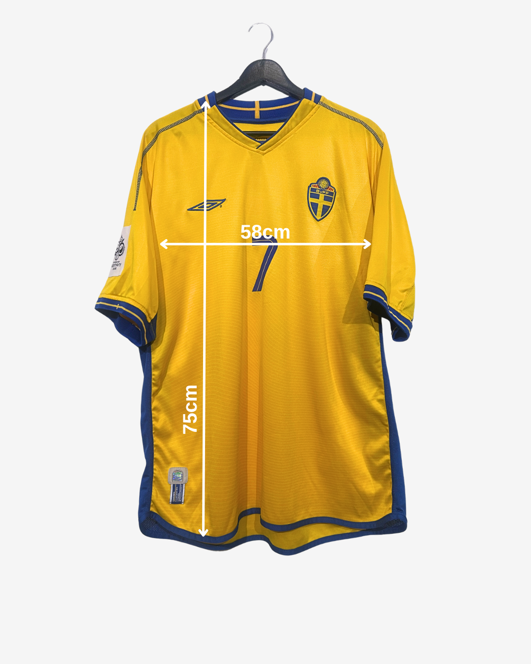 Yellow sports jersey with measurements on a white background