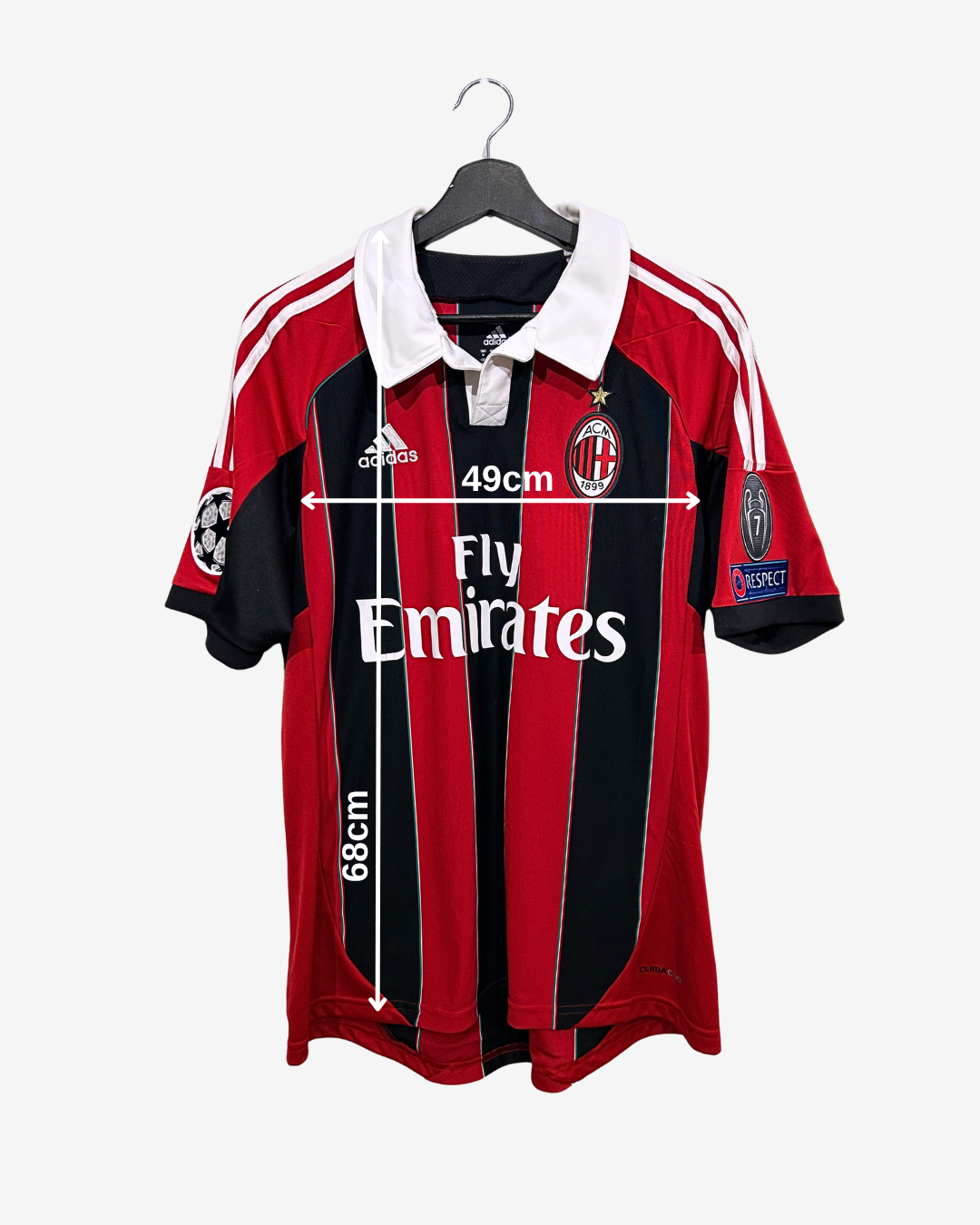Red and black sports jersey with measurements on a white background