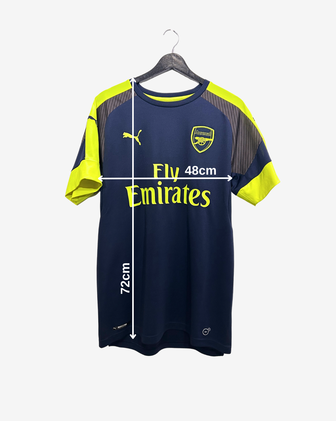 Navy and yellow sports jersey with Emirates branding on a white background