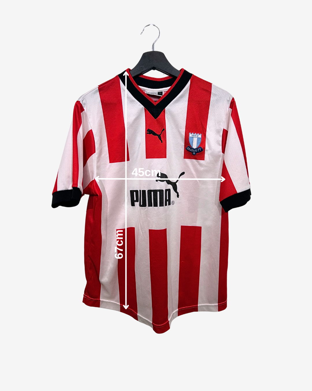 Red and white striped sports jersey with Puma logo on a hanger against a white background
