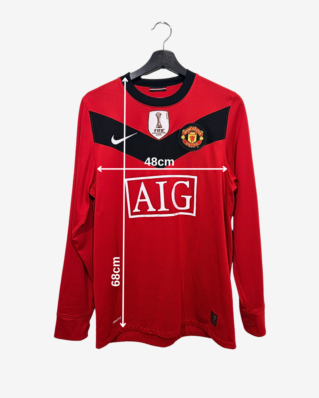 Red sports jersey with measurements on a white background
