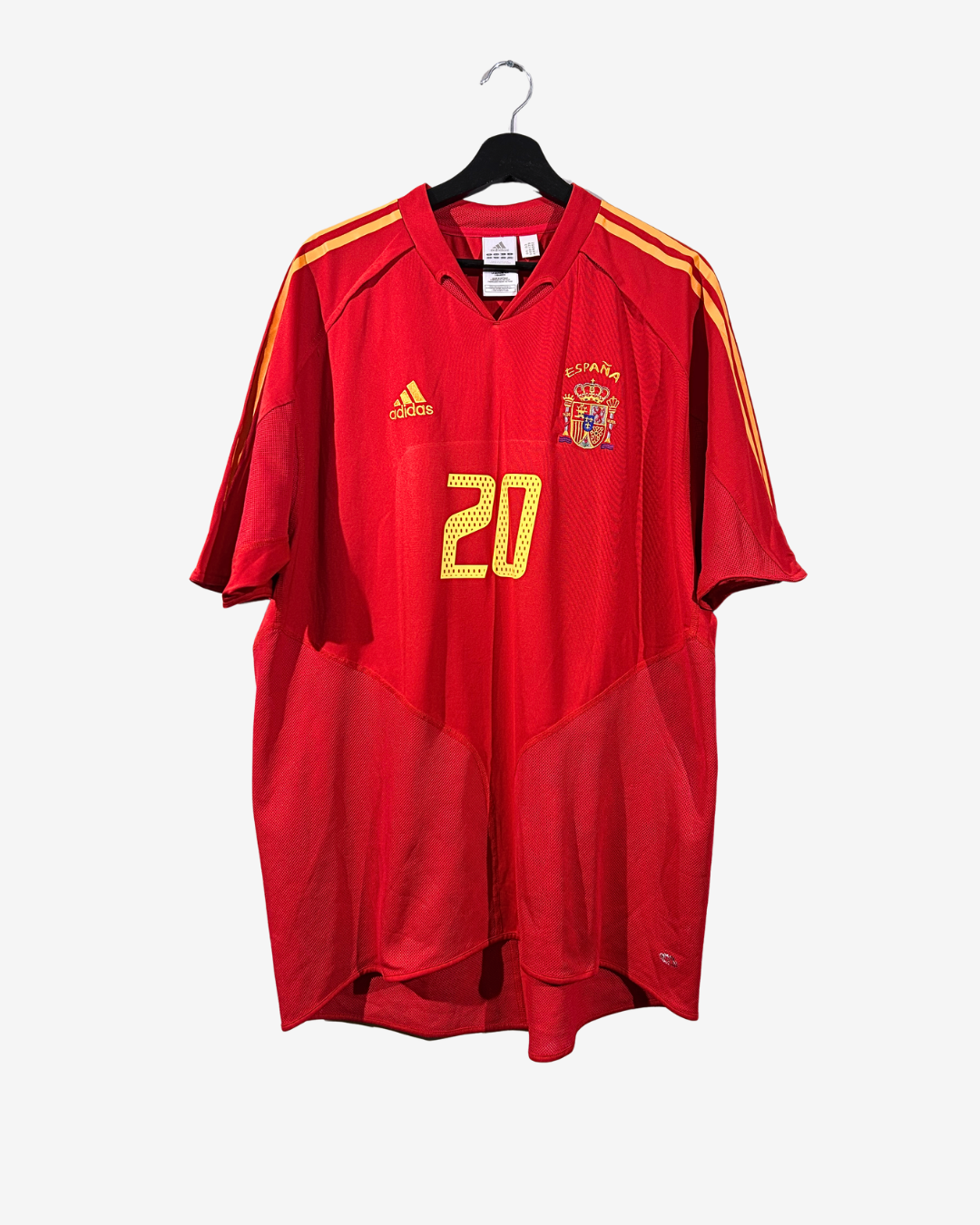 Red sports jersey with number 20 on a hanger against a white background