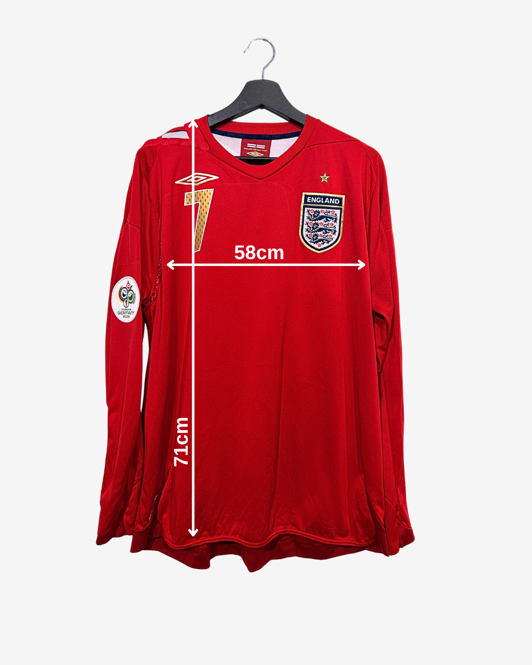 Red sports jersey with measurements on a white background
