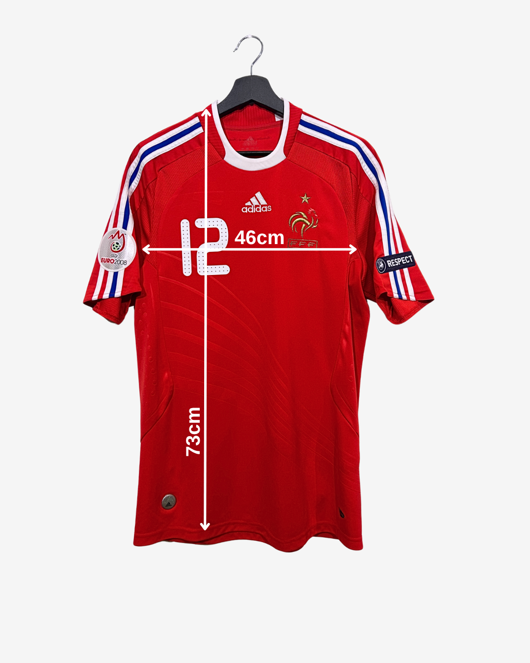 Red sports jersey with measurements on a white background