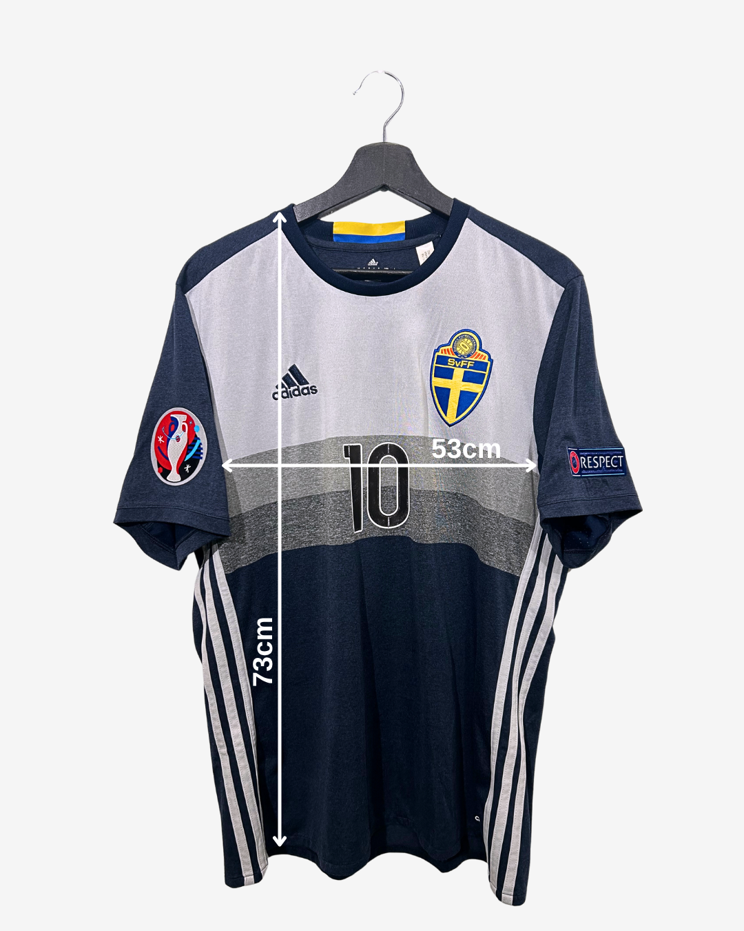 Navy and gray sports jersey with measurements on a white background