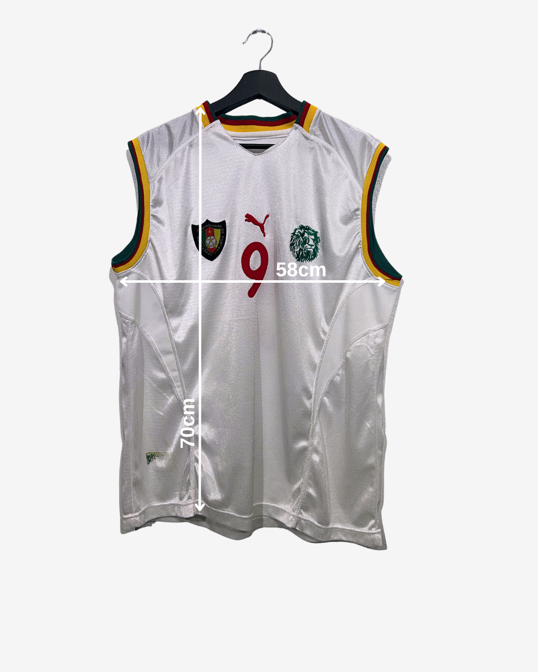 White sleeveless sports jersey on a hanger with measurements indicated.