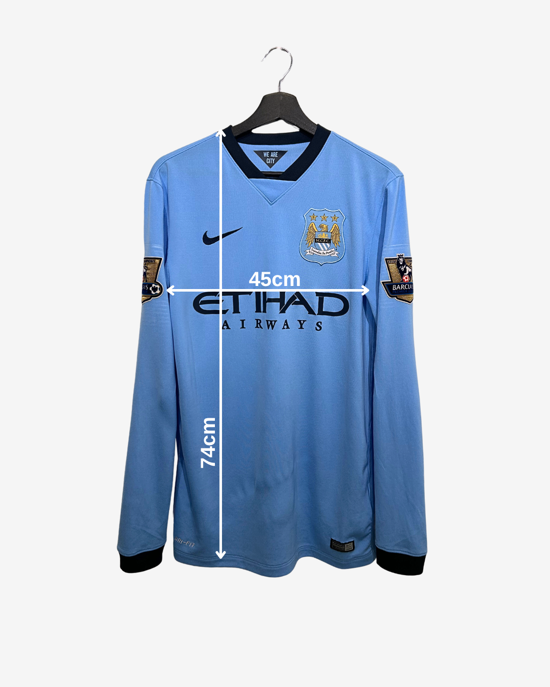 Blue sports jersey with measurements on a white background