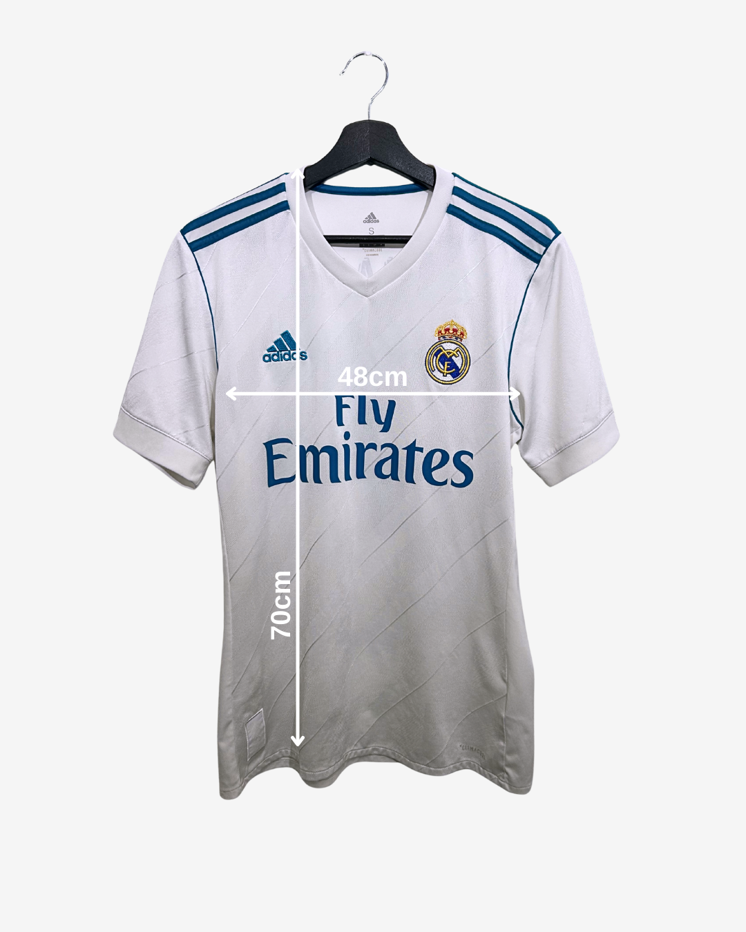 White sports jersey with Adidas and Real Madrid logos, measured on a white background