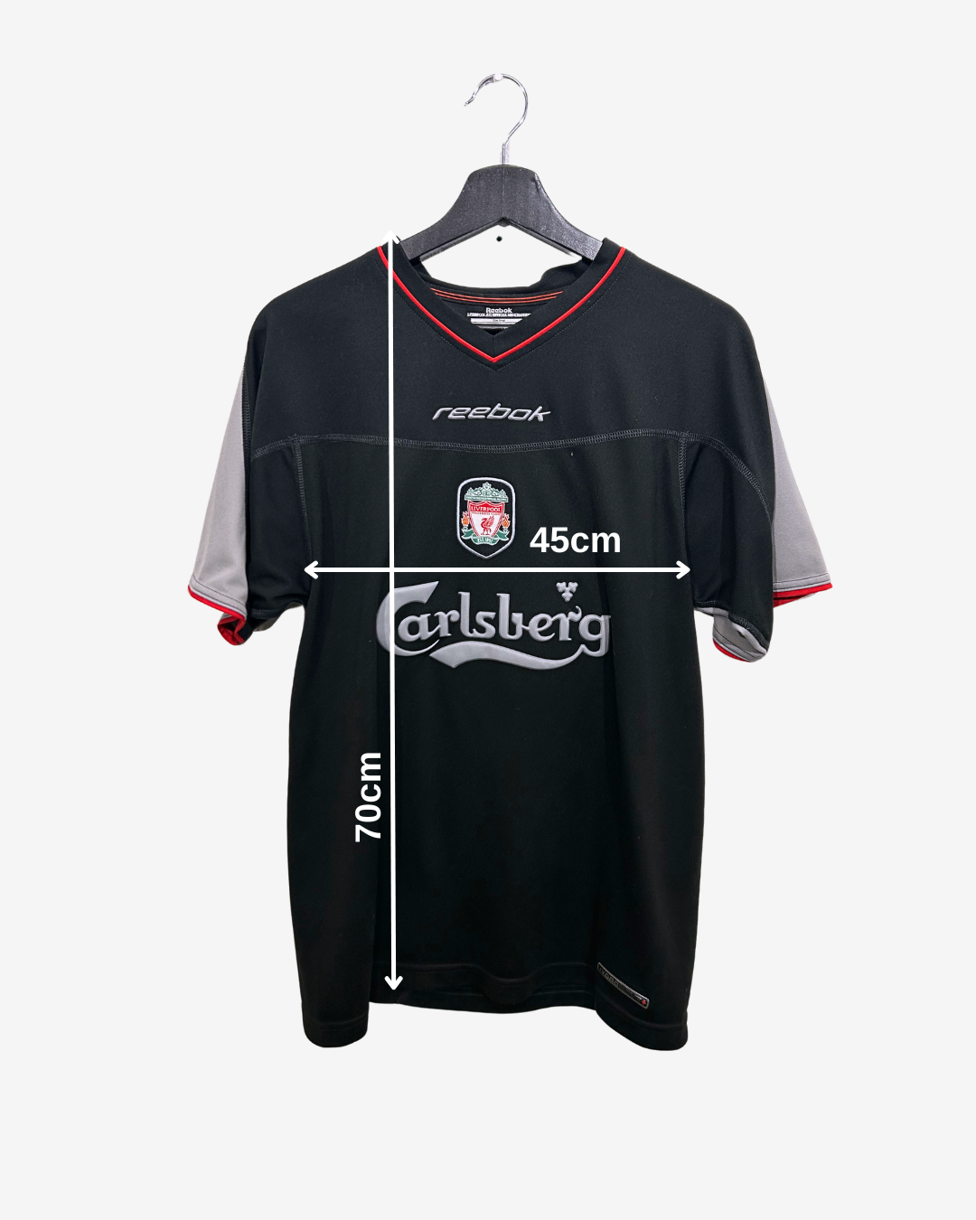 Black sports jersey with measurements on a white background