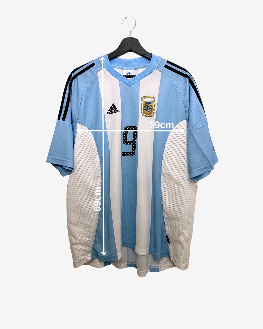Argentina soccer jersey with measurements on a white background