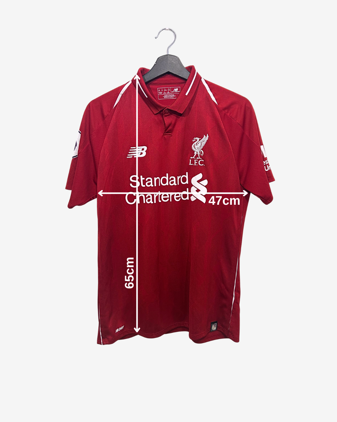 Red sports jersey with branding and measurements on a white background