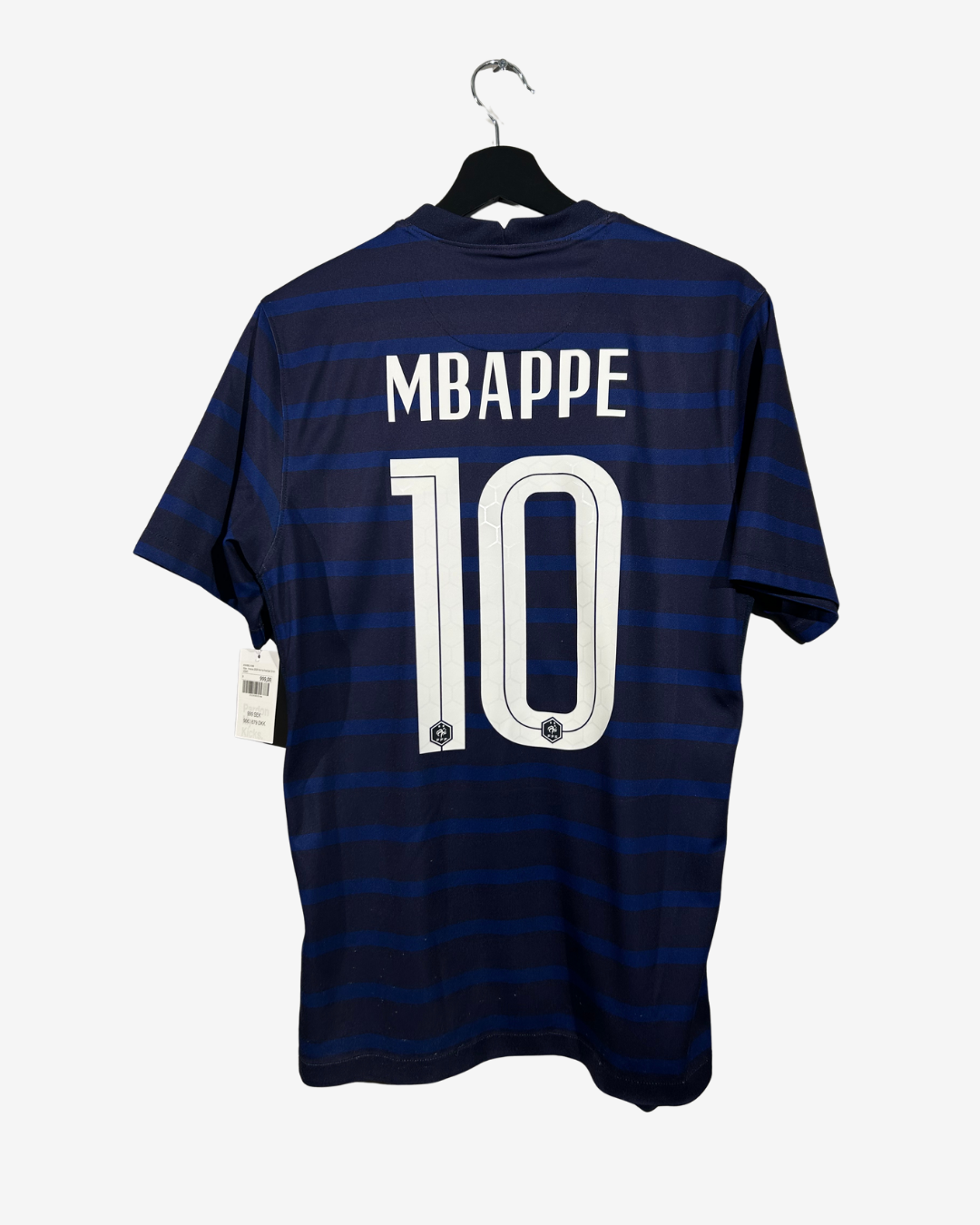 Navy blue and white striped sports jersey with 'MBAPPE' and number '10' on a hanger.