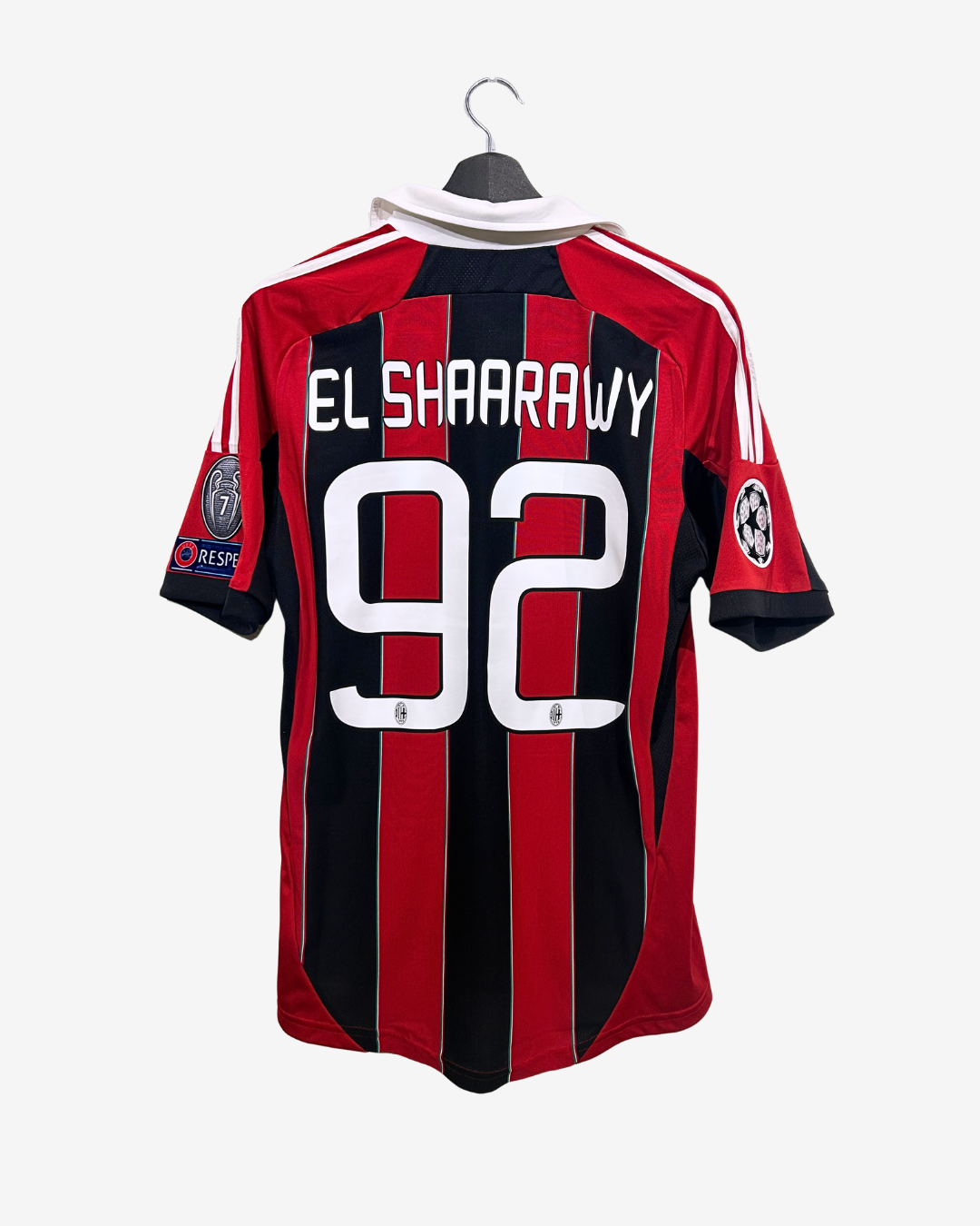 Red and black sports jersey with 'El Shaarawy 92' on a white background