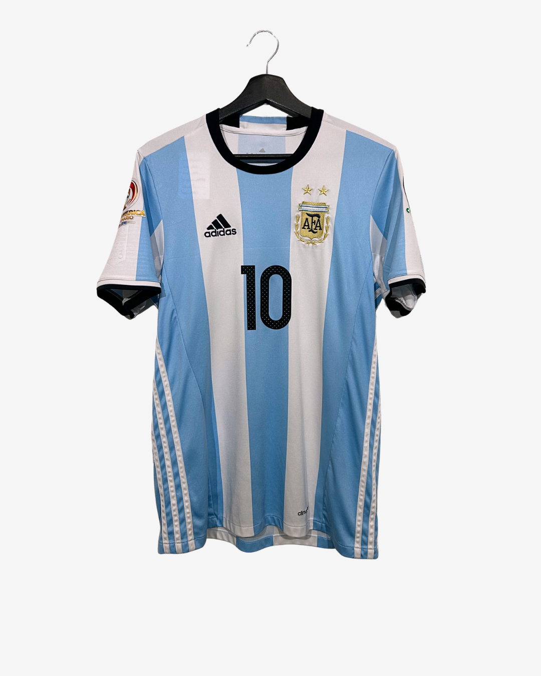 Argentina soccer jersey with number 10 on a hanger against a white background