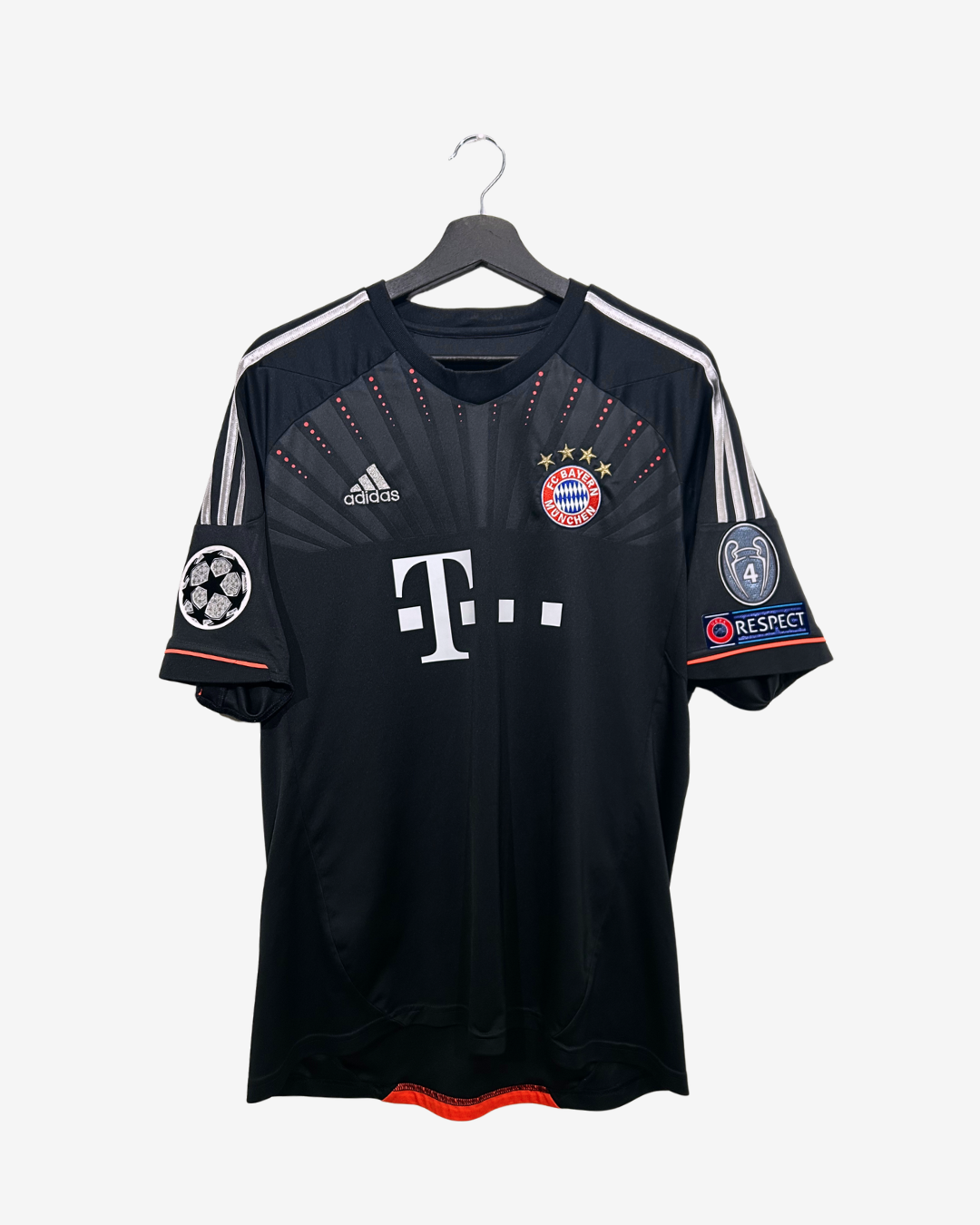Black sports jersey with visible branding on a hanger against a white background