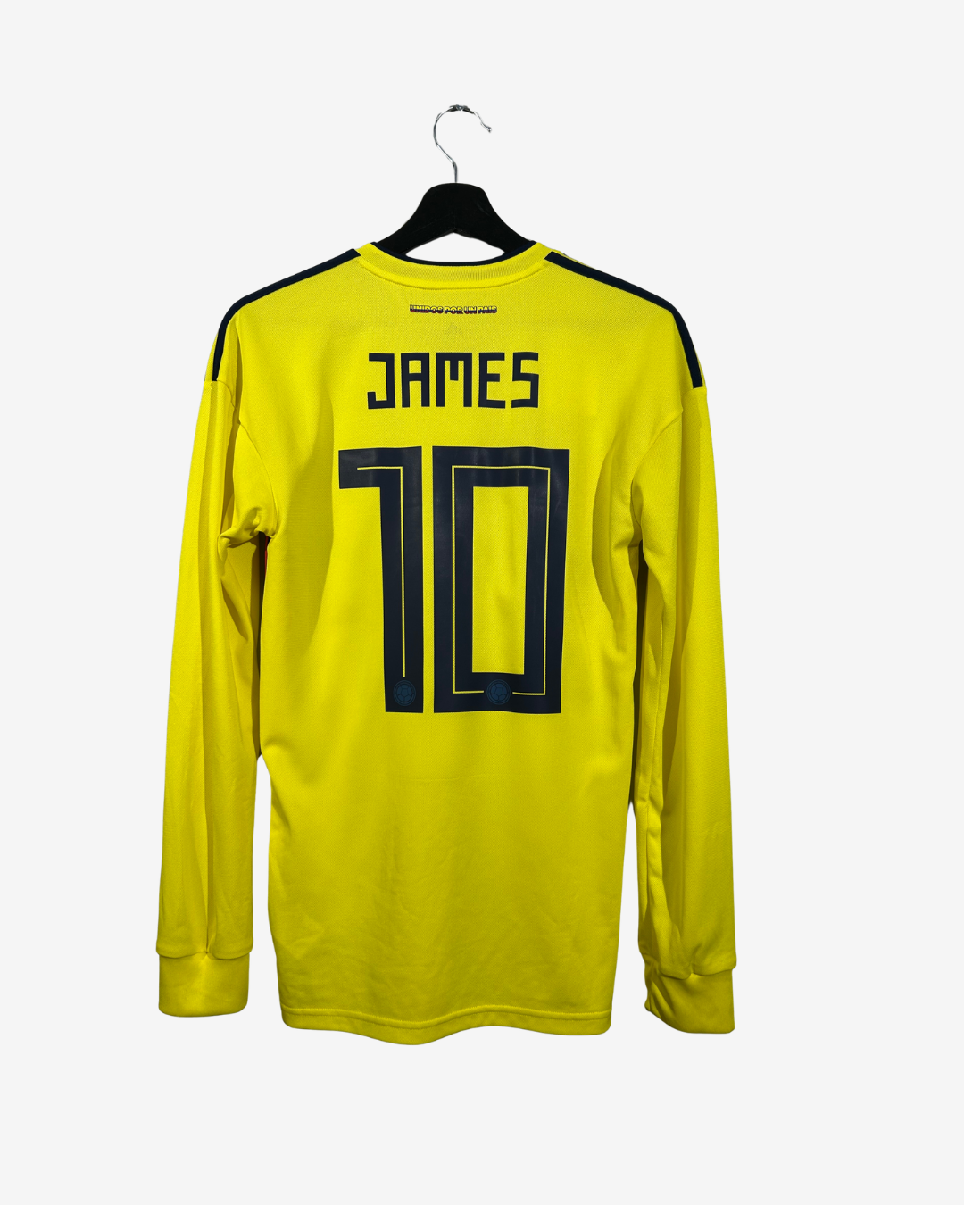 Yellow soccer jersey with 'James' and number '10' on a hanger against a white background