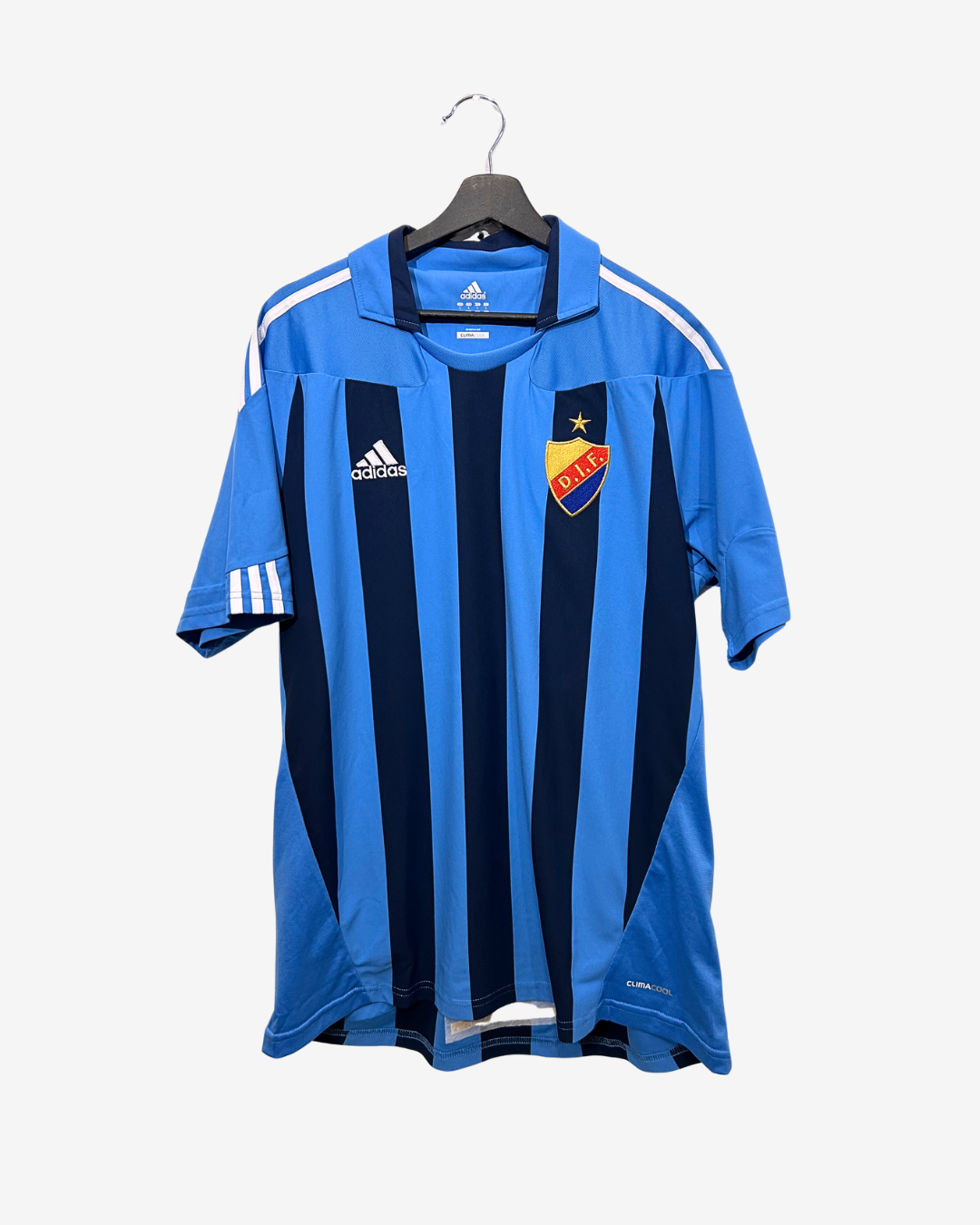 Blue sports jersey with Adidas logo on a hanger against a white background