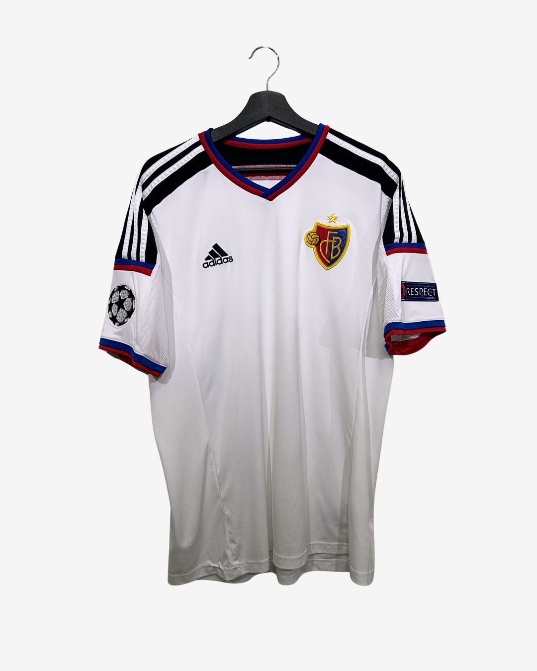 White sports jersey with black and red accents on a hanger against a white background