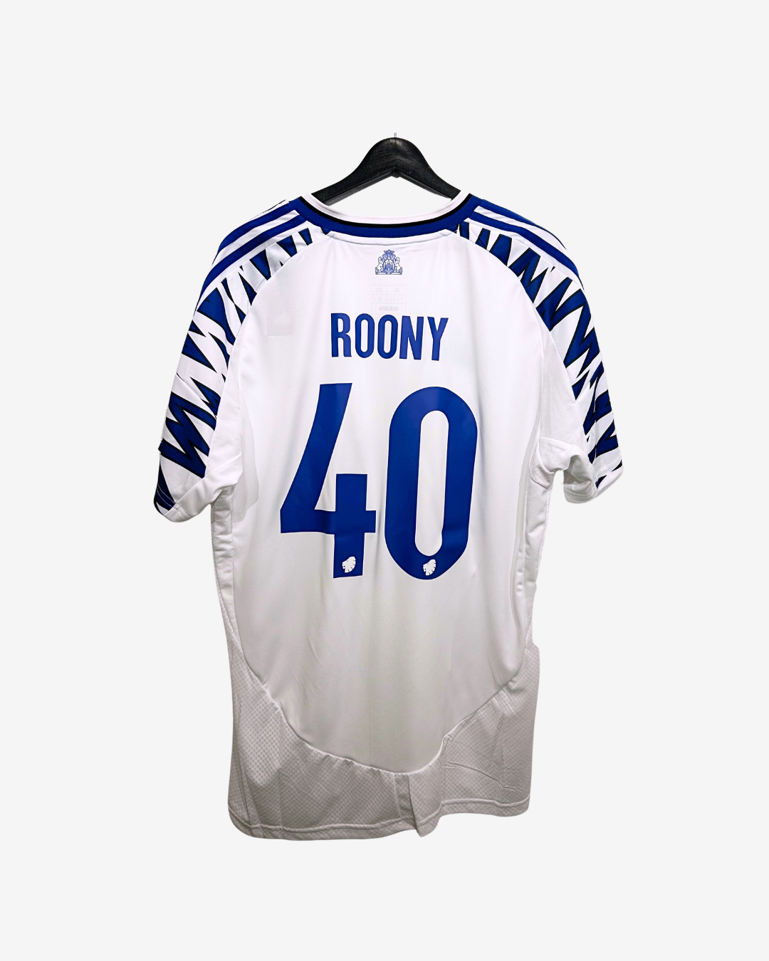 Roony jersey with blue numbering and text on a hanger against a white background
